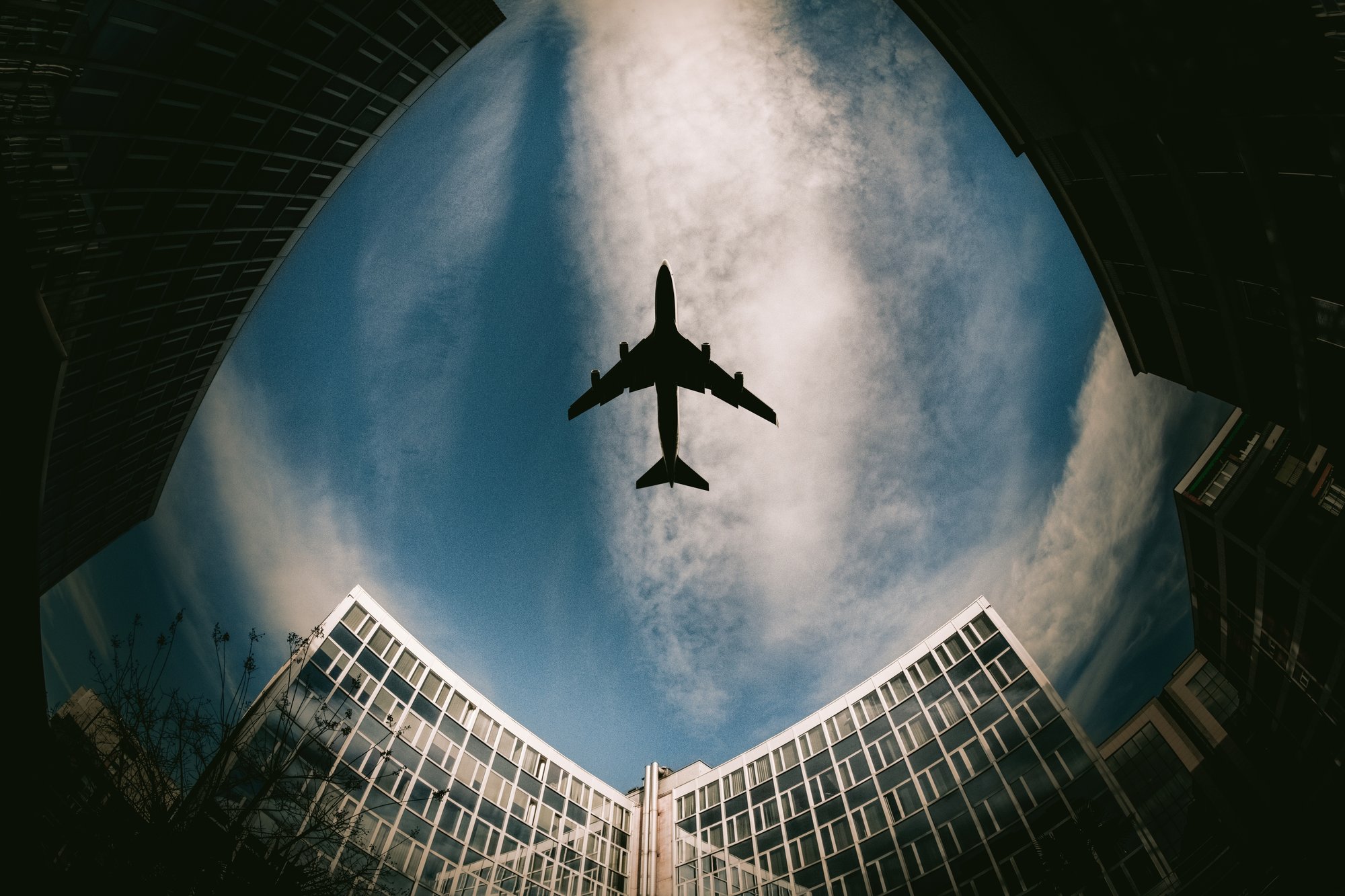 low-angle-silhouette-of-an-airplane-surrounded-by-2023-11-27-04-49-54-utc
